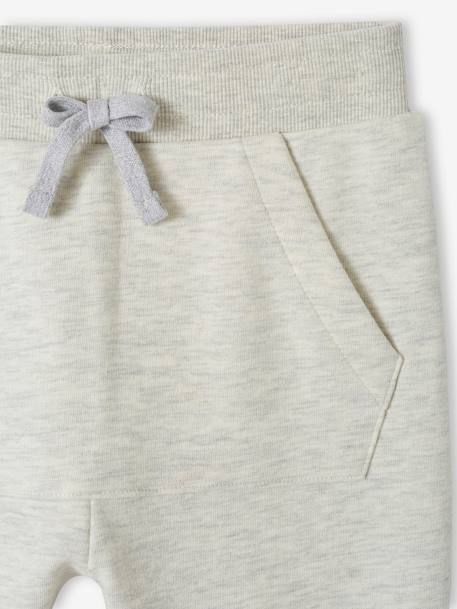 Pantalón jogging deportivo con bolsillos canguro fantasía para niño blanco jaspeado 