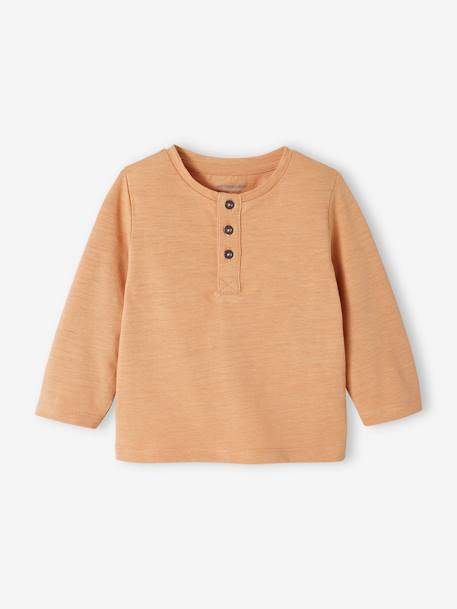 Camiseta con mensaje bordado naranja bebé niña