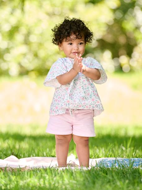 Blusa con motivo de flores para bebé crudo 